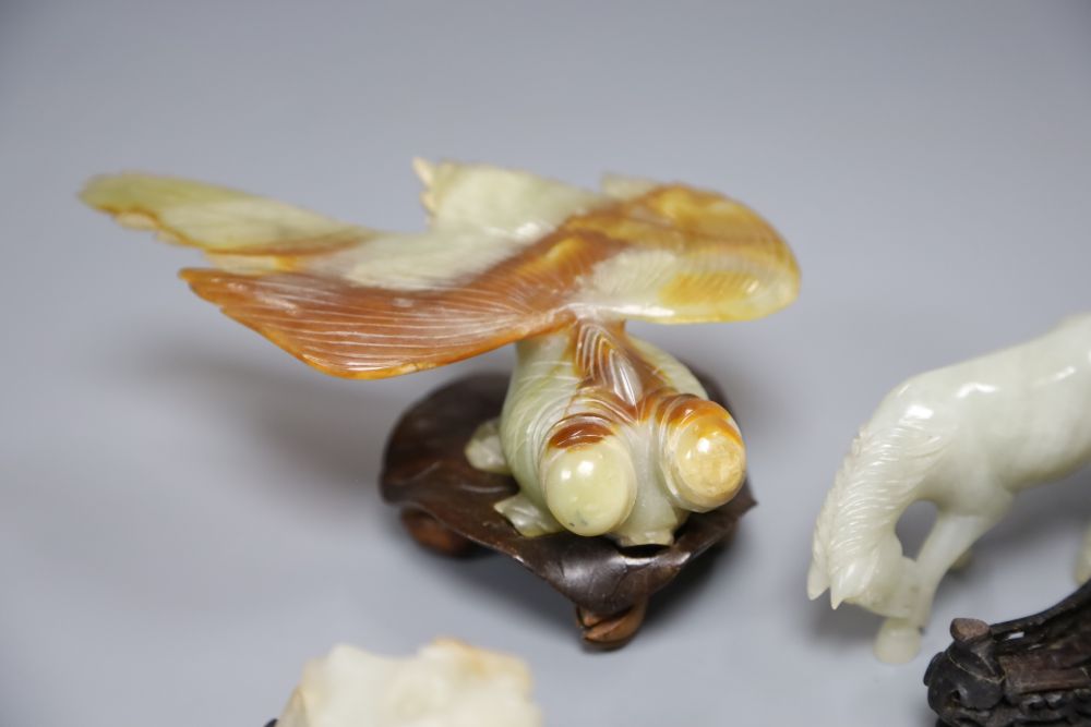 A Chinese jade figure of a buffalo, a hardstone horse and carp and a soapstone monkey